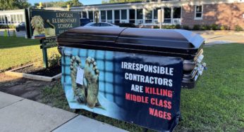 Local Union Places a Coffin With an Image of a Dead Body in Front of This Elementary School